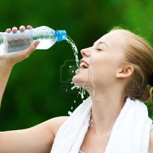 10582963-young-woman-drinking-water-after-fitness-exercise[1]